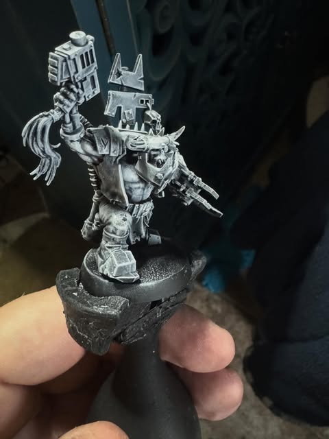 Assembled Ork Warboss miniature awaiting paint